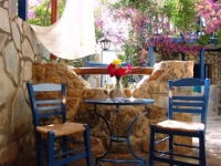  A veranda with garden view at Vassilia Rooms & Suites, Livadakia, Serifos